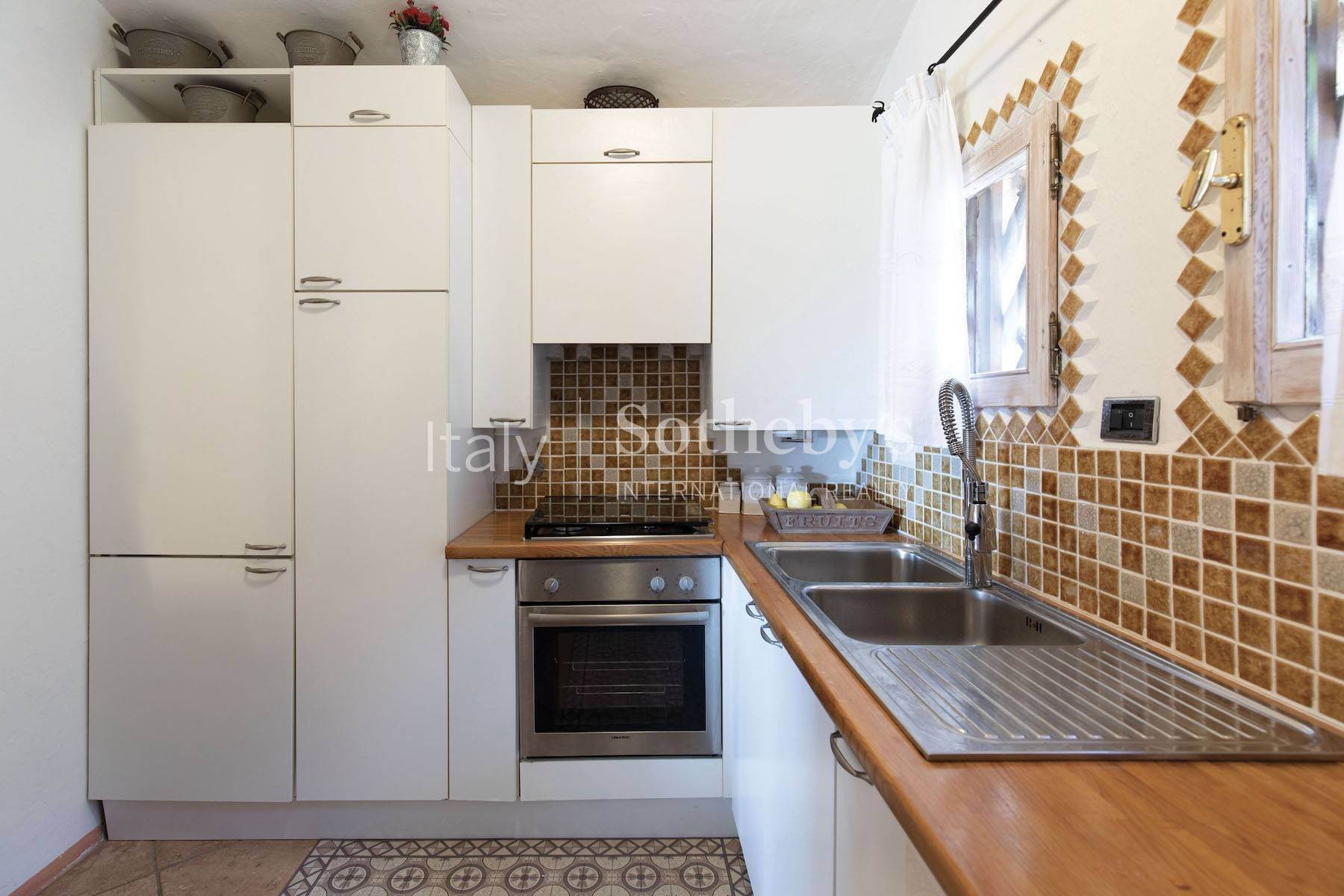 7. Apartments for Sale at Cozy and turnkey semi-detached villa on the Pevero Golf hill Porto Cervo, Sassari Italy